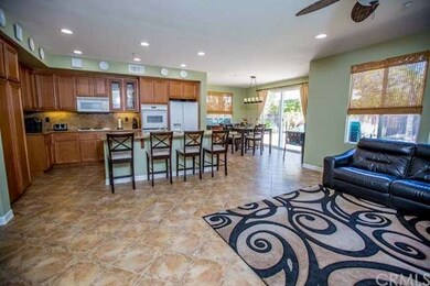 Family room opens to kitchen and access to back ya