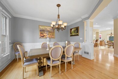 The dining room is complimented by wainscoting and