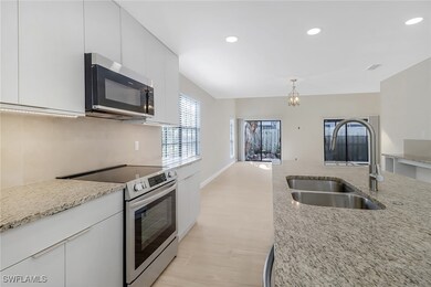 Kitchen featuring light stone countertops, recesse