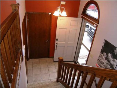 The entry foyer includes tile floor and a large co