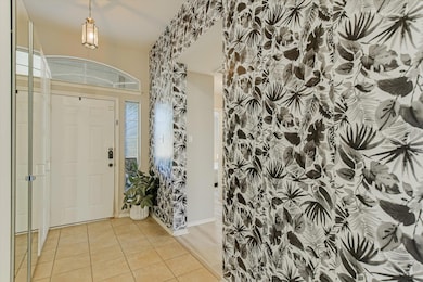 View of tiled entryway and feature wall