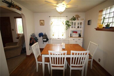 Dining room with exposed hardwood floors.