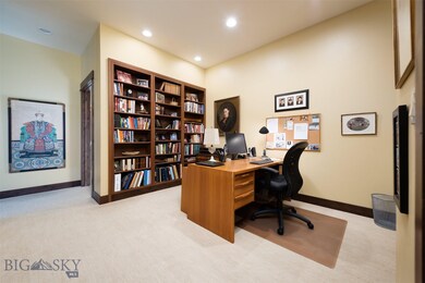 Private office area with built-in book shelves.