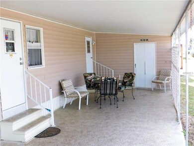 Back half of double carport is used for patio area