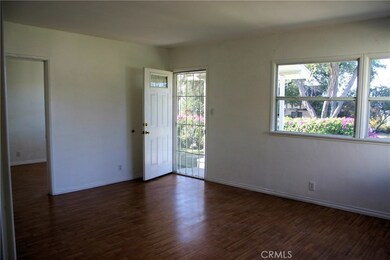 Bright living room with laminate flooring.