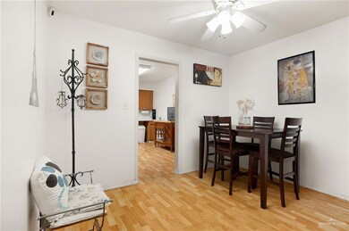 Dining room featuring ceiling fan and light wood-type flooring