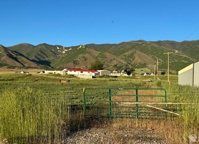 View of mountain backdrop featuring rural landscape