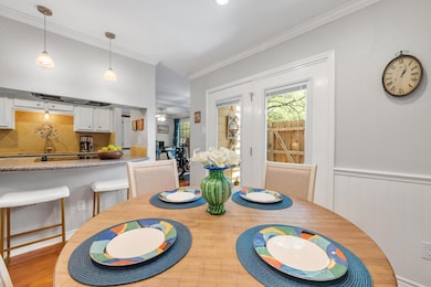 Dining space featuring ornamental molding, a ceil