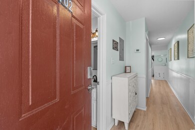 Corridor with light wood finished floors, electric