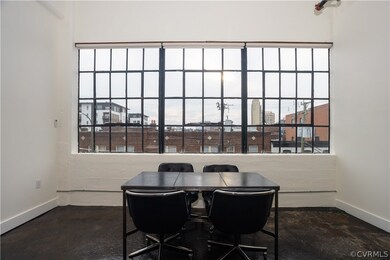 Dining room featuring concrete flooring