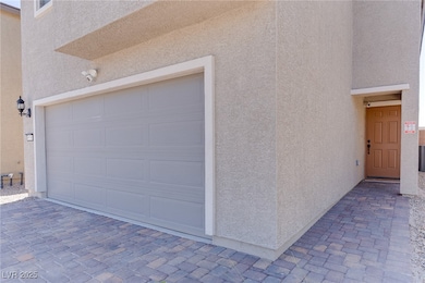 Garage with decorative driveway