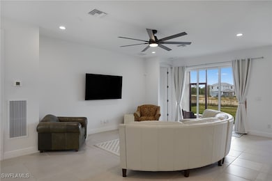 Living Room opens to Screened Lanai
