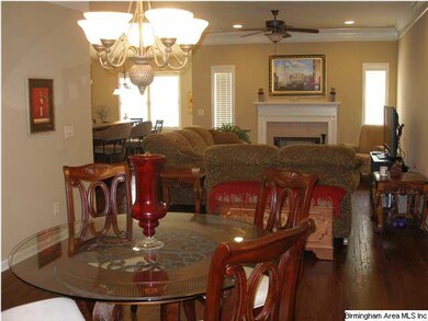 Open  plan has beautiful distressed wood flooring 