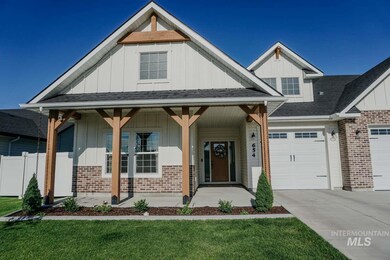 Craftsman house with board and batten siding, a garage, a porch, roof with shingles, and driveway