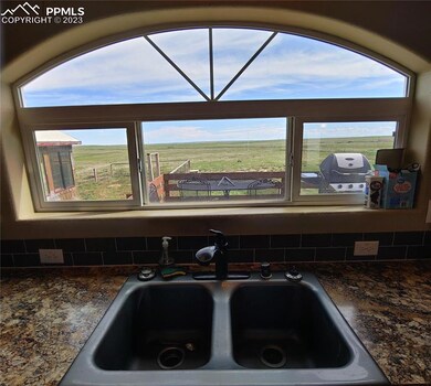 Southern view from Kitchen Sink. Lots of sun in wi