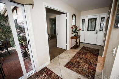 The entry to the home features custom tile