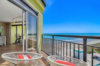 Balcony with a view of the beach and a water view