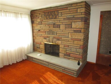 Living room with raised hearth fireplace