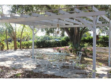 Gazebo with glass top table and chairs, and chanda