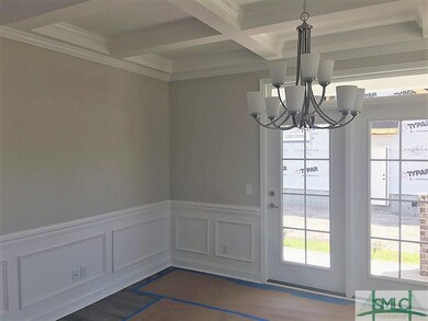 Formal dining room with coffered ceiling