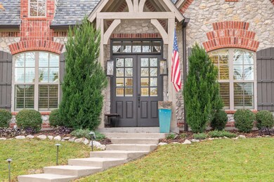 Beautiful elevated entry with French Doors.