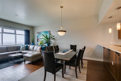 Dining room featuring dark wood-type flooring and
