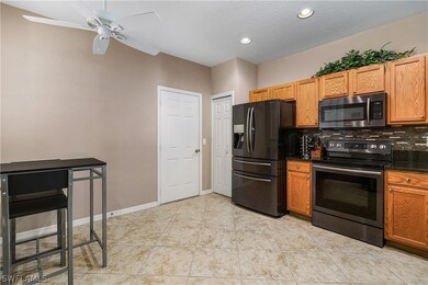 Kitchen with eat-in area, door to garage, and pant