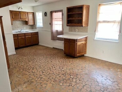 Kitchen with sink, a healthy amount of sunlight, a