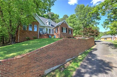 View of front of home with brick siding, a front l