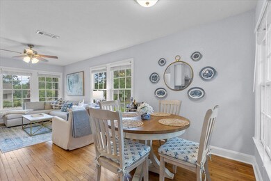 Dining room with a ceiling fan, baseboards, visib