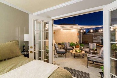 Master bedroom that opens up to the outdoor patio.
