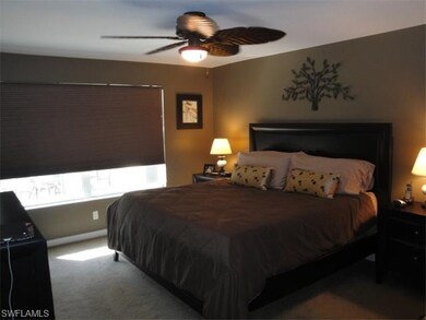 Master bedroom suite with custom fan.
