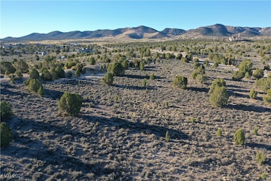 View of mountain background featuring rural landscape