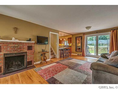 Living Room. Beautiful hardwoods with a wood burni