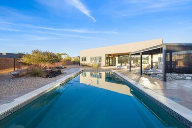 View of pool with a patio, a fenced backyard, and a sunroom