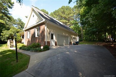Over-sized 3-car side load garage! Lots of room fo