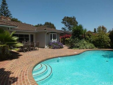 Glimmering pool with brick patio and great spot fo