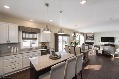 Modern painted cabinets and a walk-in pantry make for ample storage. The mudroom with closet and powder room are just beyond the kitchen. Sparkling lights for a brightly lit work space and entertaining.