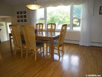 Dining Room. Hardwood floor, big window, cathedral