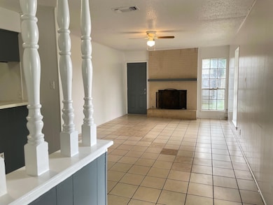Unfurnished living room with visible vents, a fir