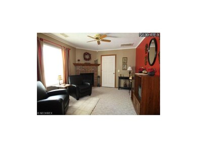 Den w/gas fireplace. Door leads to laundry room w/