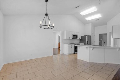 Dining area with an inviting chandelier