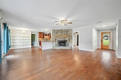 Unfurnished living room with a fireplace, crown m