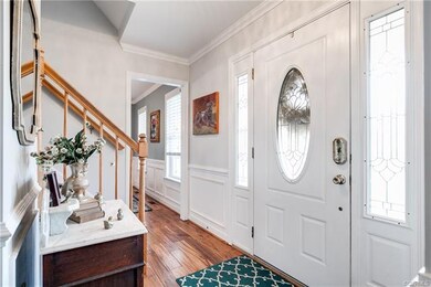 The foyer is welcoming with lovely trim detailing,