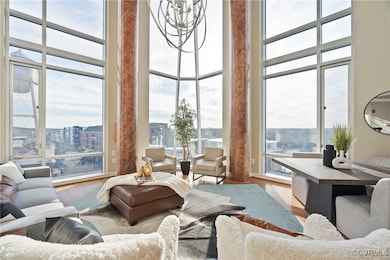 2 story windows with automatic blinds look out to