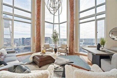 2 story windows with automatic blinds look out to