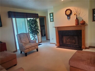 Sliders off Living Room lead to rear covered deck