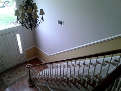 Fabulous two story entry with wood floors and wood