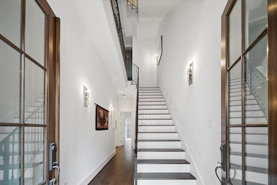 Double front doors lead you to the entryway with 1