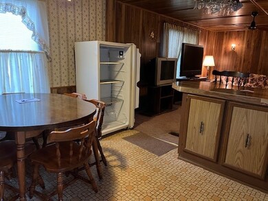 kitchen 8x12 with a island and a view of living ro